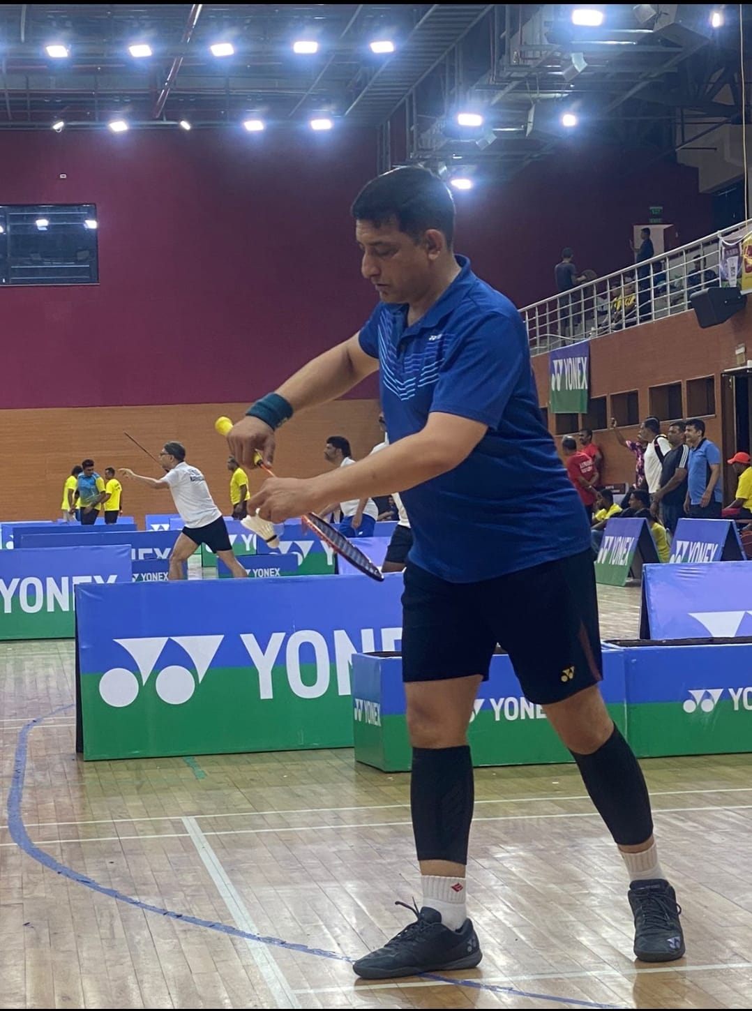 Coach Ashish Khedikar demonstrating badminton techniques